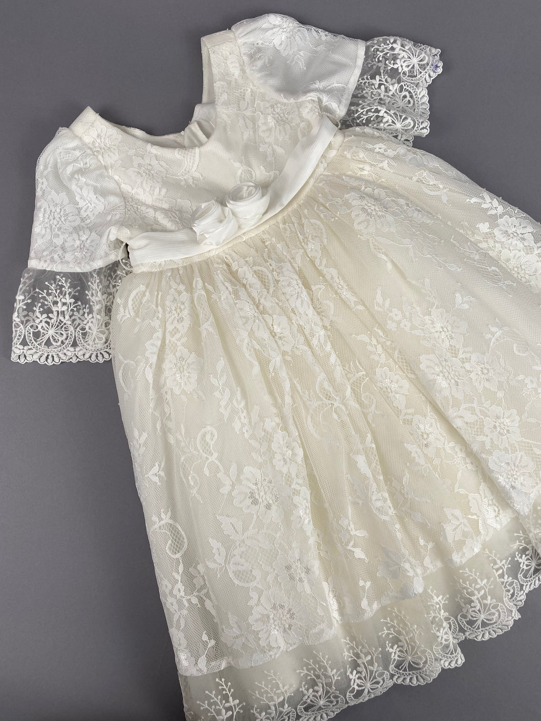 Dress 105 Girls Baptismal Christening French Lace Gown with Sleeves and Adjustable Belt. Made exclusively for Rosies Collections.